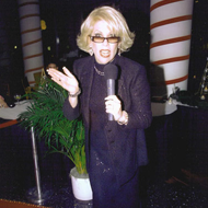 Dee Dee Hanson Talking On a Microphone